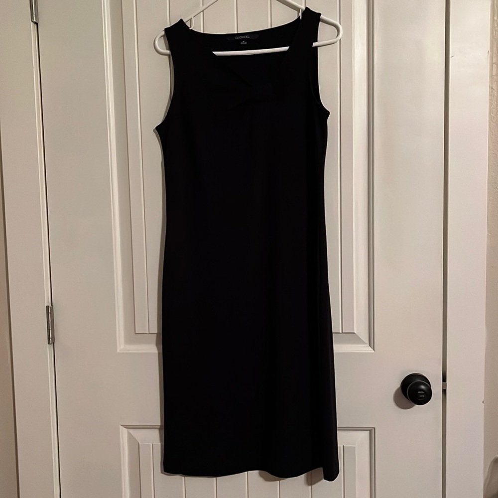 Black Chadwick’s dress. Asymmetrical neckline and below the knees knee Length .